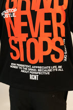 Black T-shirt with bold orange text 'NEVER STOPS' and white motivational phrases about persistence and hustle
