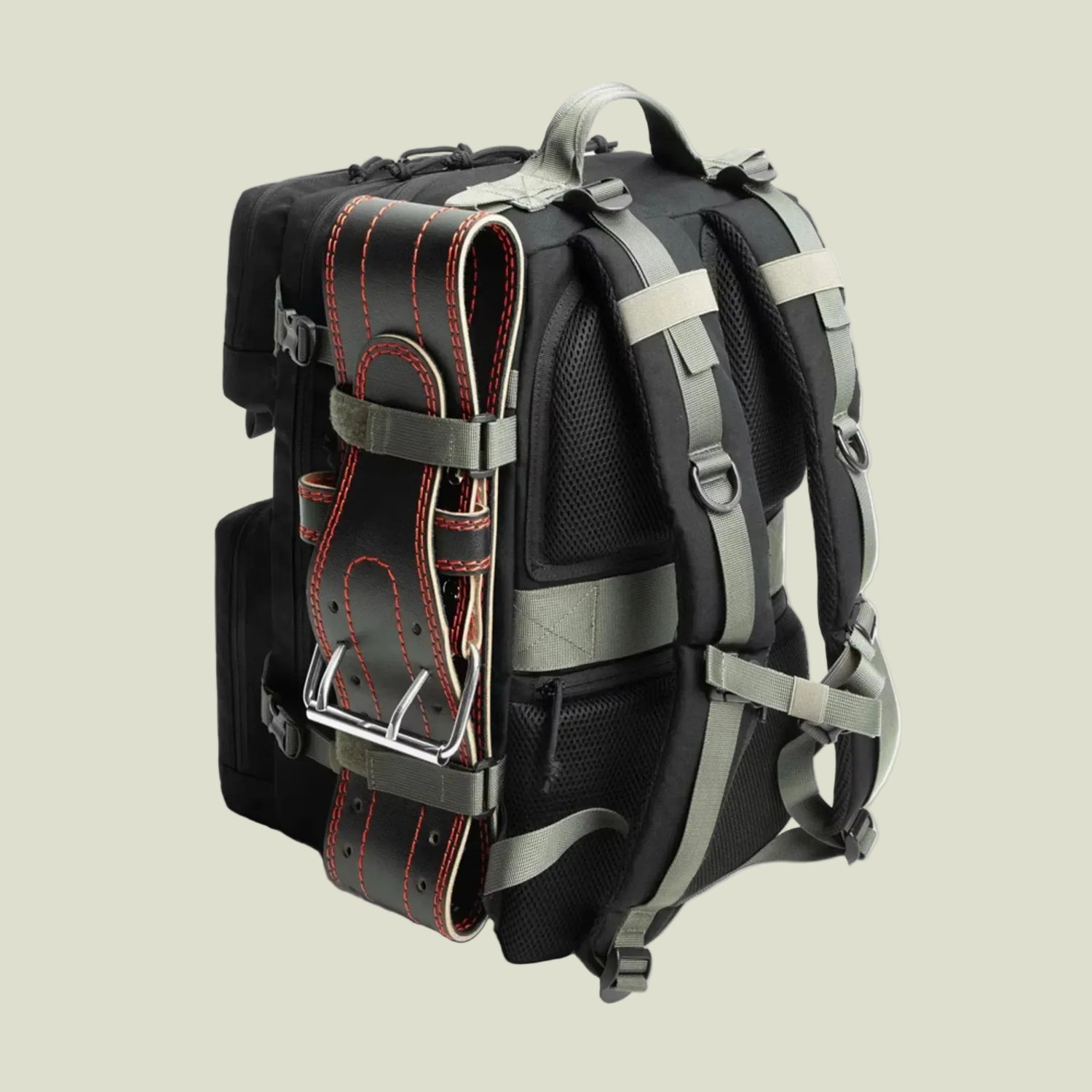 Black backpack with padded straps and attached black weightlifting belt with red stitching on side