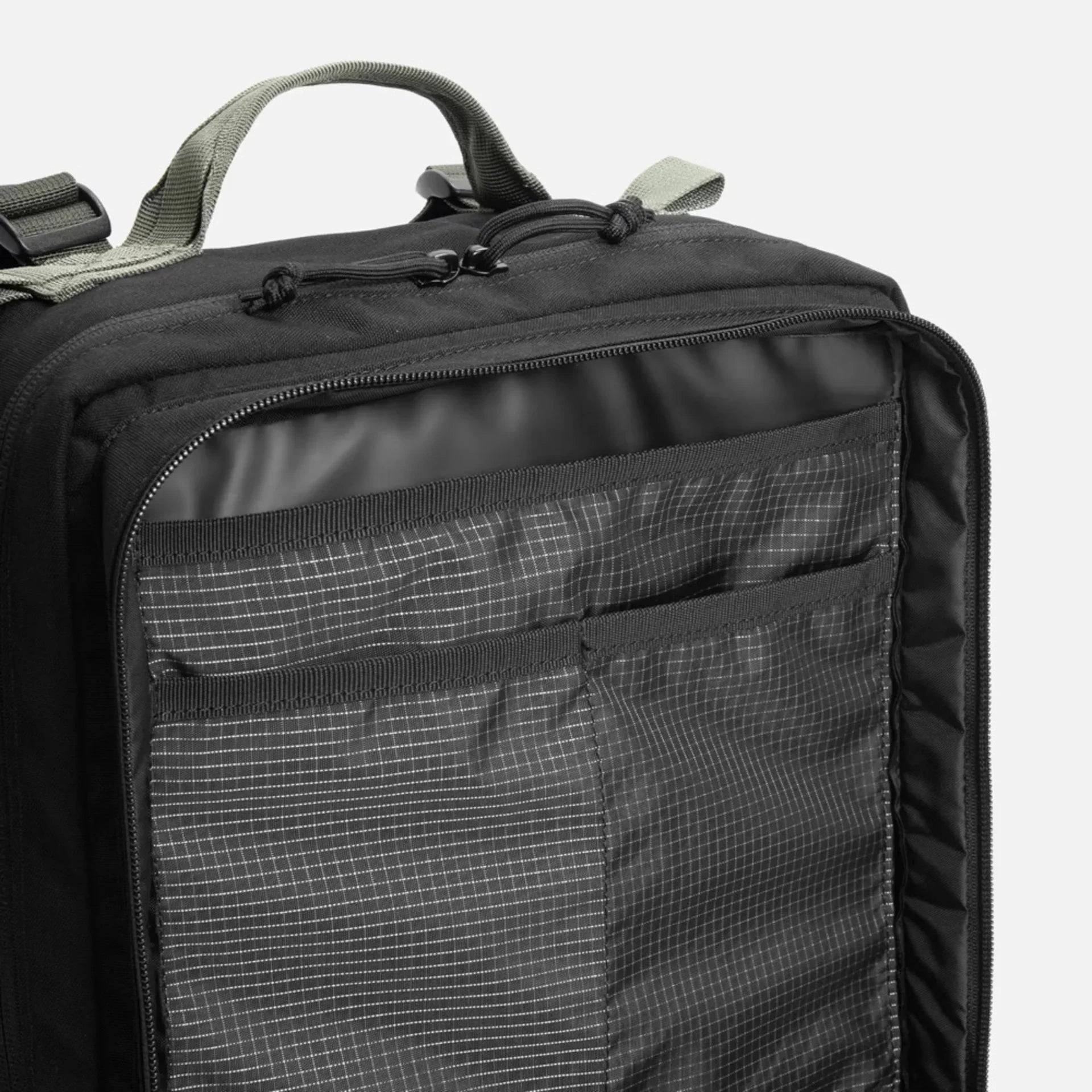 Black backpack with grid-patterned internal organizer pocket and gray handle