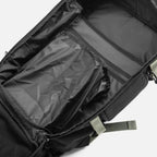 Black backpack with open compartments showing spacious interior and organizational pockets