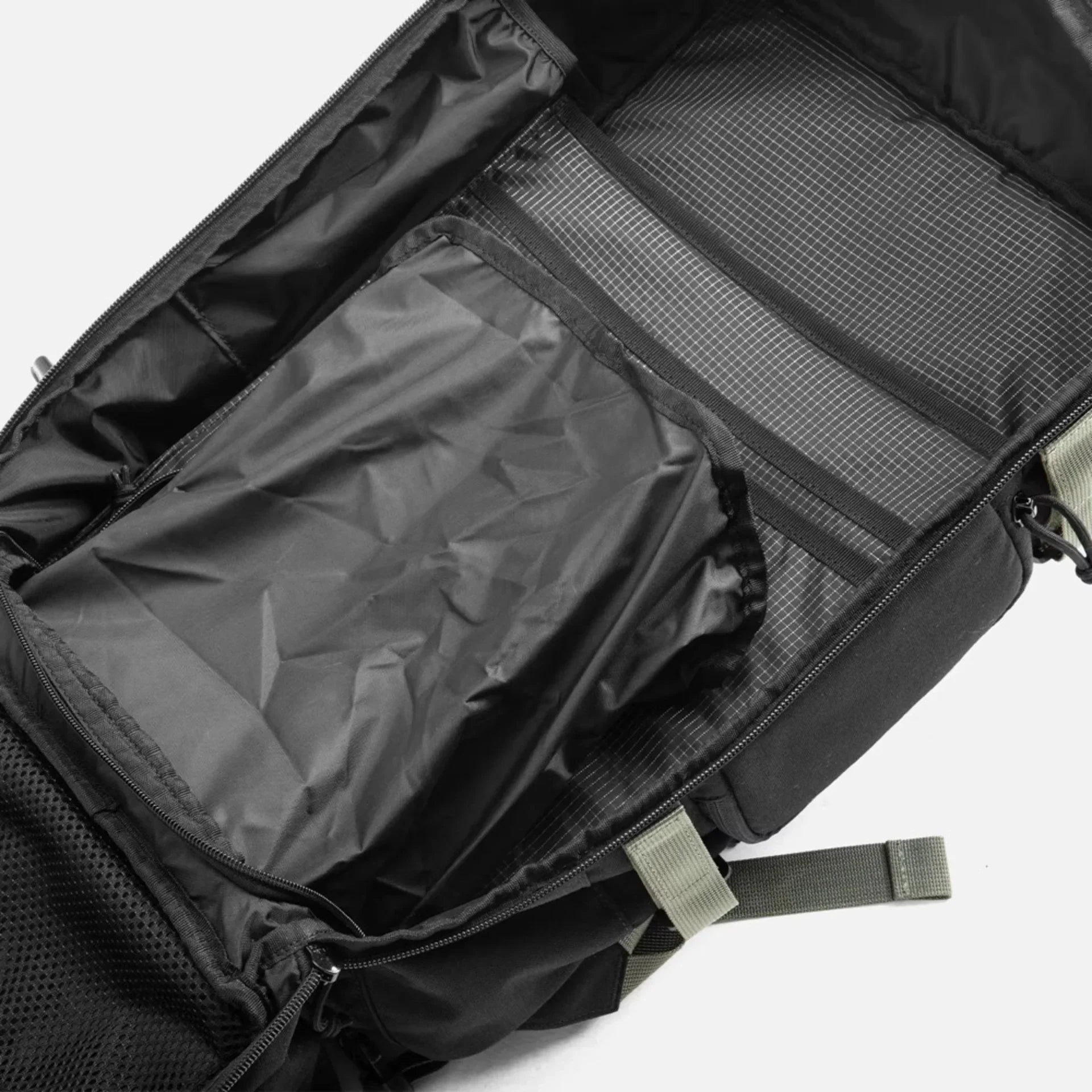 Black backpack with open compartments showing spacious interior and organizational pockets