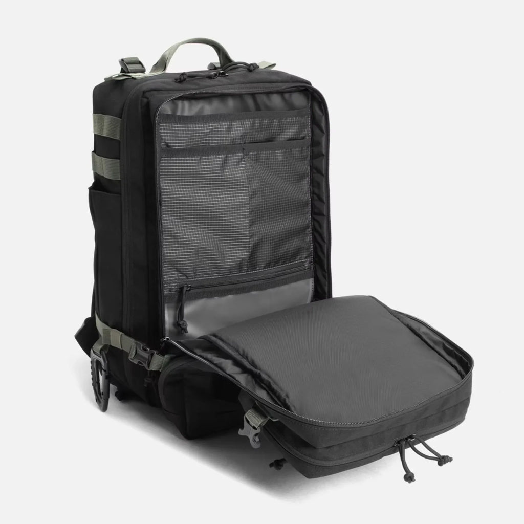 Black backpack with open front compartment showcasing multiple interior pockets and organized storage