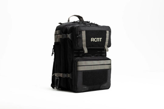 Black tactical backpack with RCNT logo, multiple compartments, and gray straps on white background