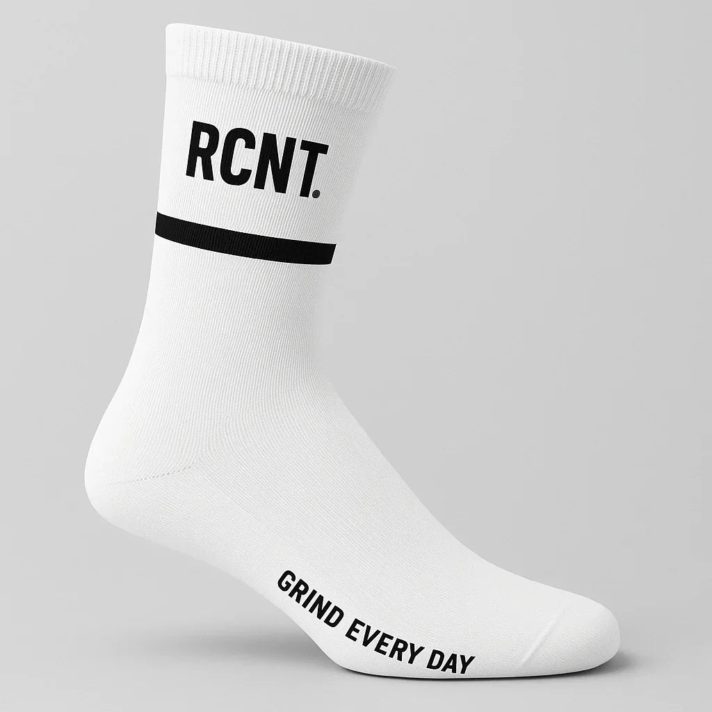 White athletic sock with black text RCNT and slogan Grind Every Day on a light gray background