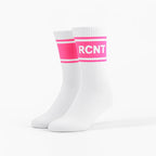 Pair of white crew socks with neon pink retro stripes and RCNT text band