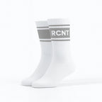 Pair of white retro crew socks with gray stripes and RCNT lettering on a white background