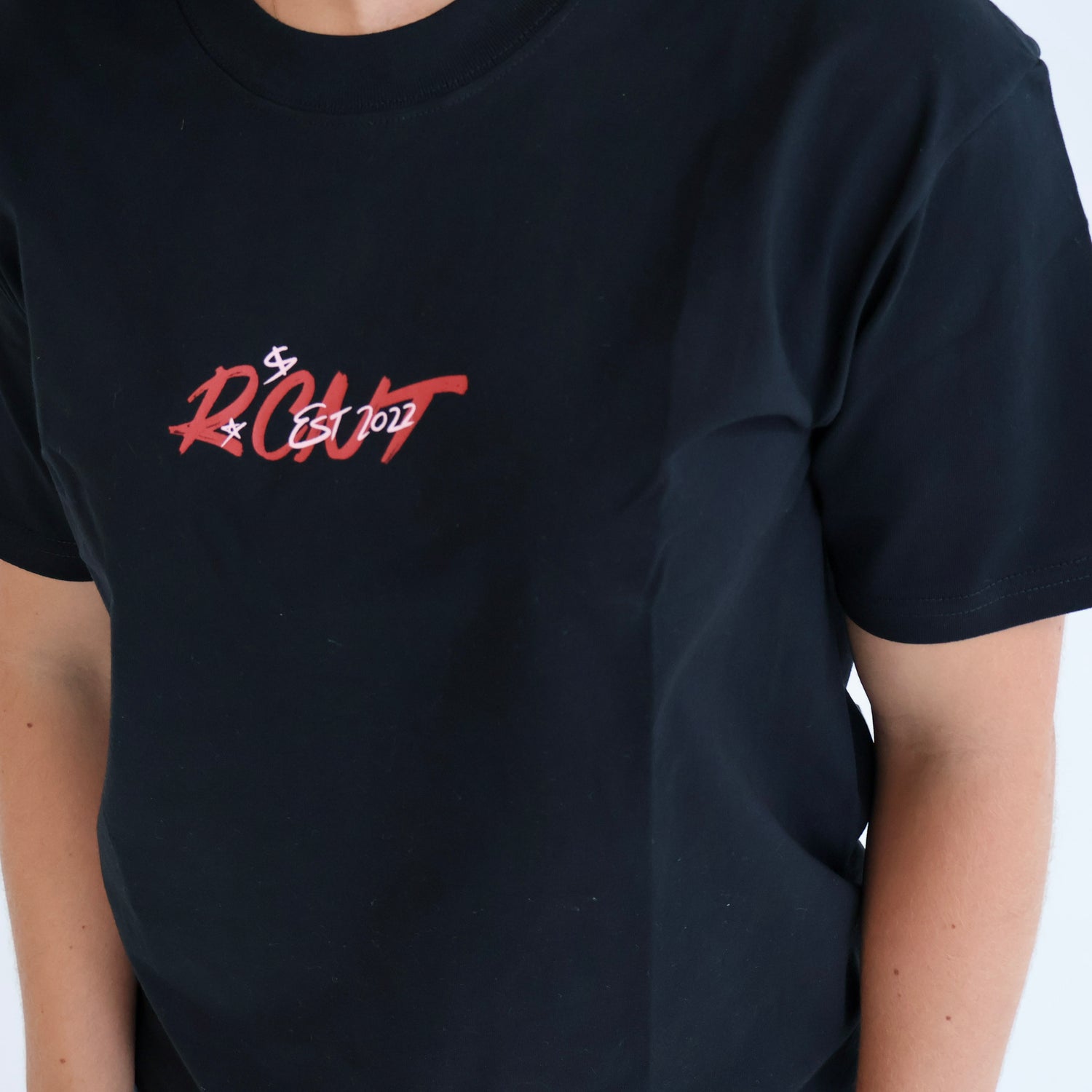Black crew neck t-shirt with red 'RCNT EST 2022' graphic on chest, casual streetwear