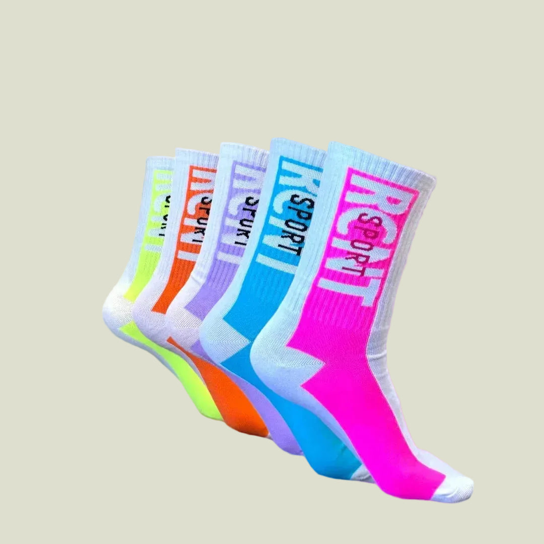 Set of colorful crew socks in neon yellow, orange, purple, blue, and pink with white accents and bold lettering