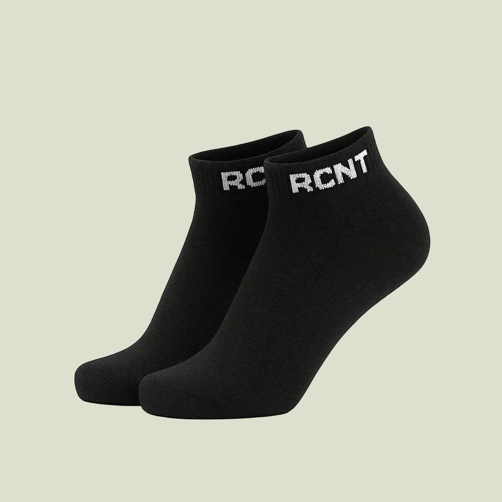 Black ankle socks with white RCNT logo on cuff, isolated on white background