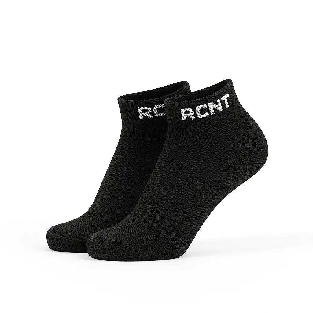 Black ankle socks with white RCNT logo on cuff, isolated on white background